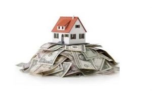 house on stack of dollar bills